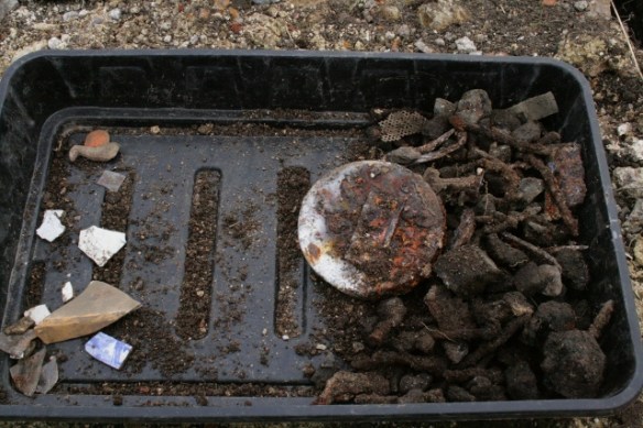 Finds tray from E side of cottage, N of chimney