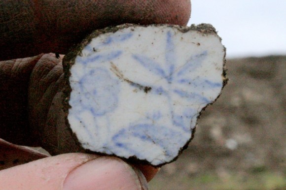 Light blue and white decorated ceramic shard