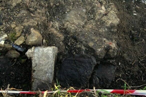 Looking N at possible in-situ brick and mortar structure S of SE corner of 'lean-to' extension