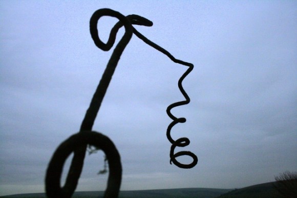 Screw picket for barbed wire