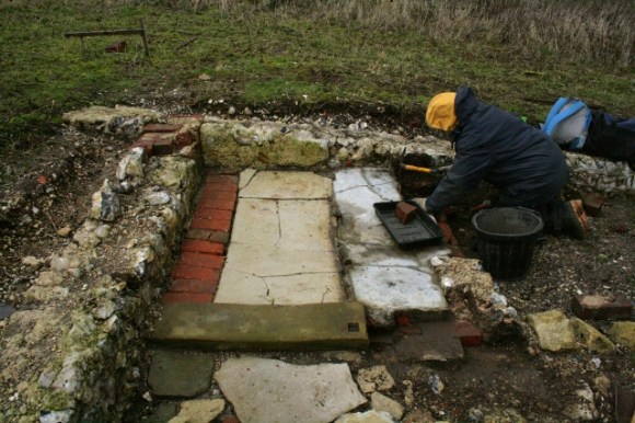 View S from beside outside toilet across dig site, battling against the cold wind!