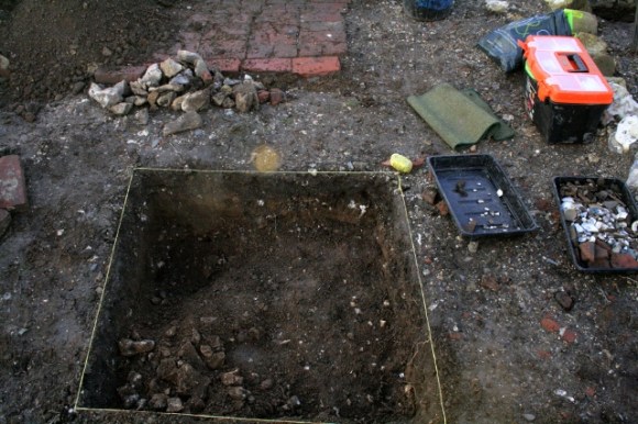 Looking W at 1x1m sondage in centre of front yard, N of cottage