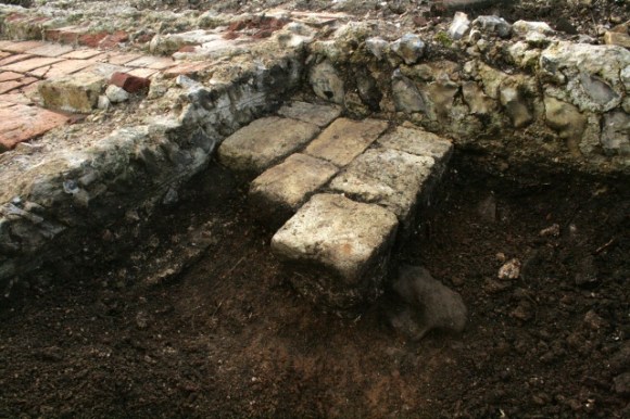 Looking SW at excavated fill surrounding unbonded masonry platform, below water pipe (just out of photo)