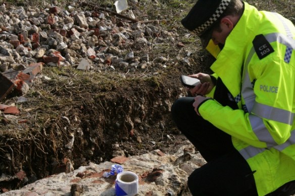 Police inspecting 3" mortar