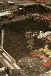 Looking SW at excavation of cobbled flint surface from front front garden gateway to front doorstep of cottage; 9th February 2014