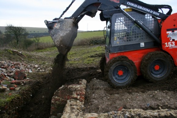 Looking S at backfilling of E side of cottage