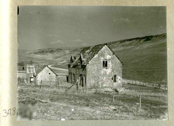 Photo 398. Slightly shell-shocked Balsdean labourer's cottages. In Captain Bertie Hubbard Maclaren's scrapbook. Brighton & Hove Royal Pavilion and Museums, ref. HA930078.