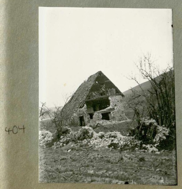 Photo 404. Badly destroyed Norton Farm. In Captain Bertie Hubbard Maclaren's scrapbook. Brighton & Hove Royal Pavilion and Museums, ref. HA930078.